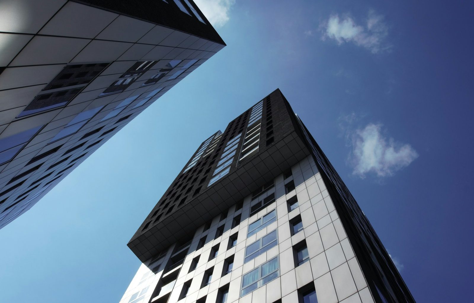 white and black concrete building under blue sky during daytime