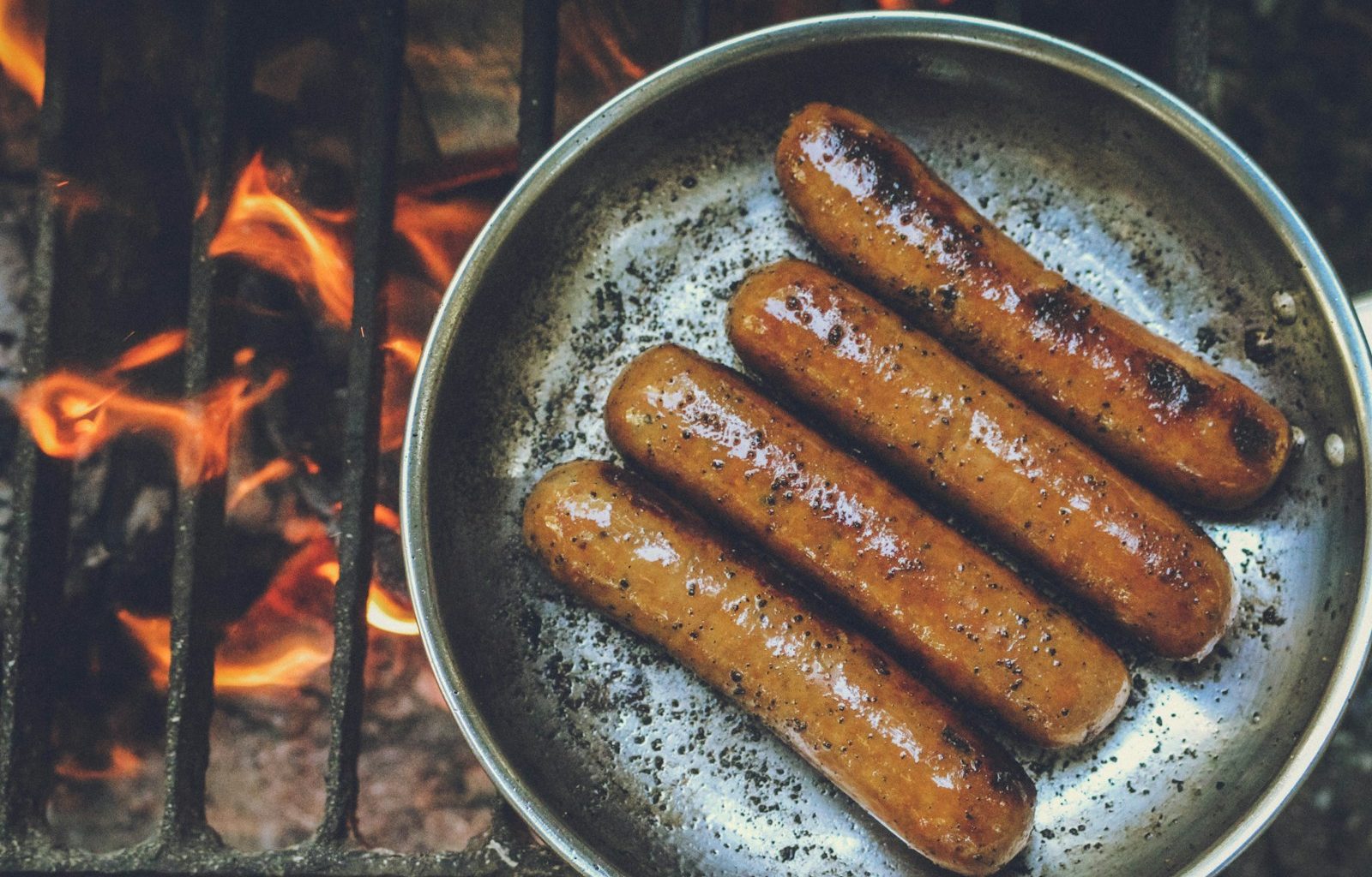 cooked sausage on round grey pan