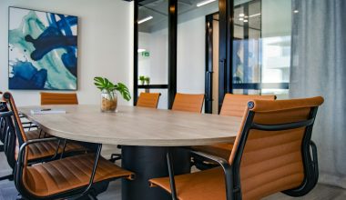 brown wooden 9-piece office table and chairs